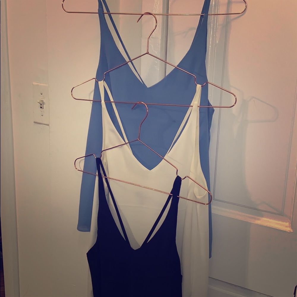 Three top shop tanks in white black and blue